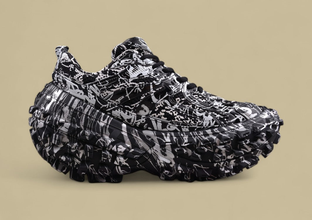 Balenciaga Defender Sneaker – Black & White Graffiti Print