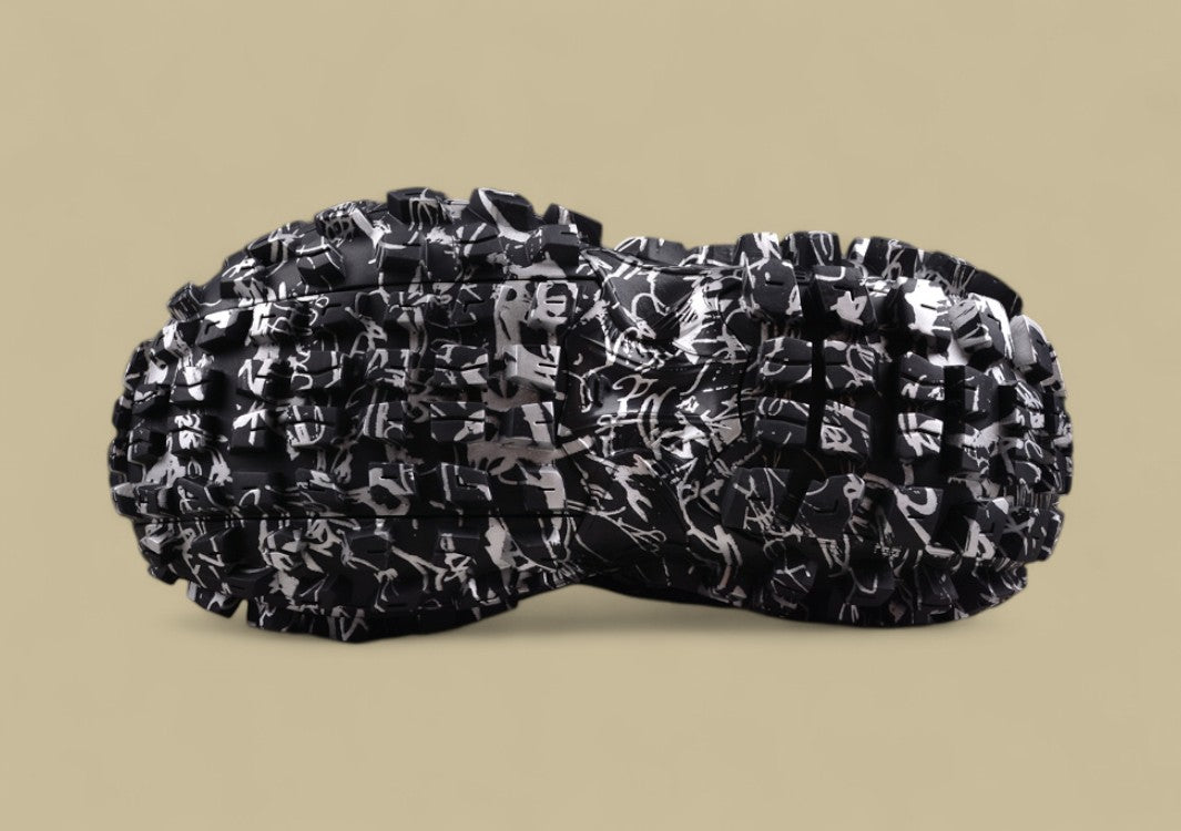 Balenciaga Defender Sneaker – Black & White Graffiti Print
