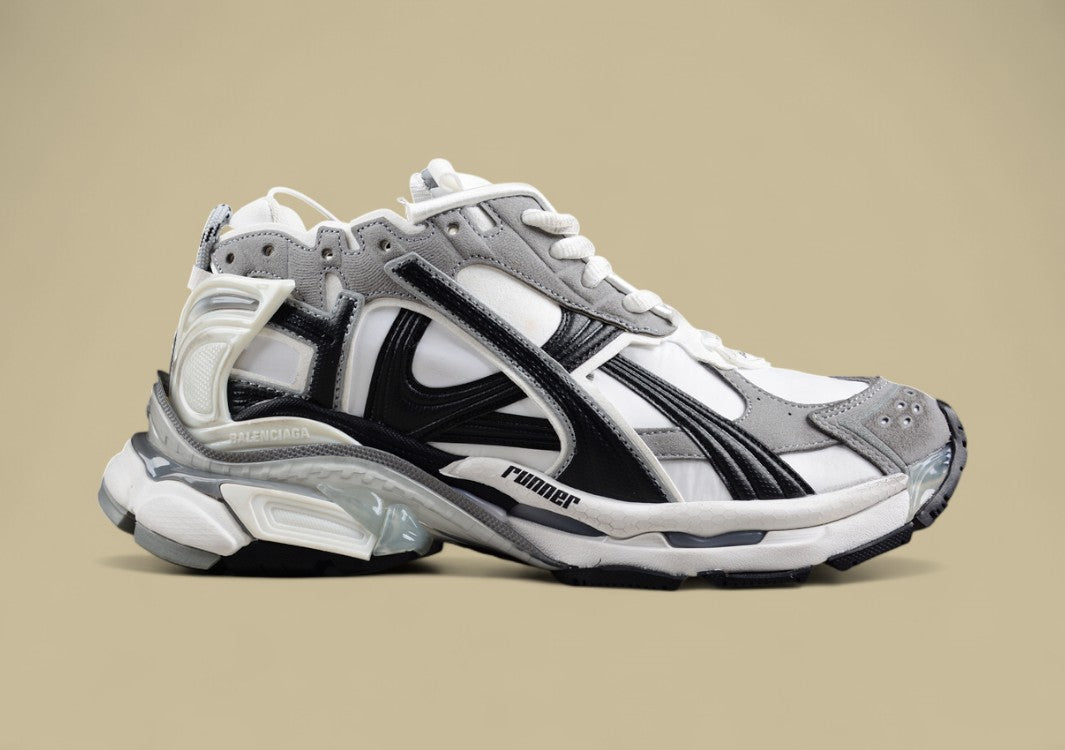 Balenciaga Runner Sneaker in a white, grey, and black
