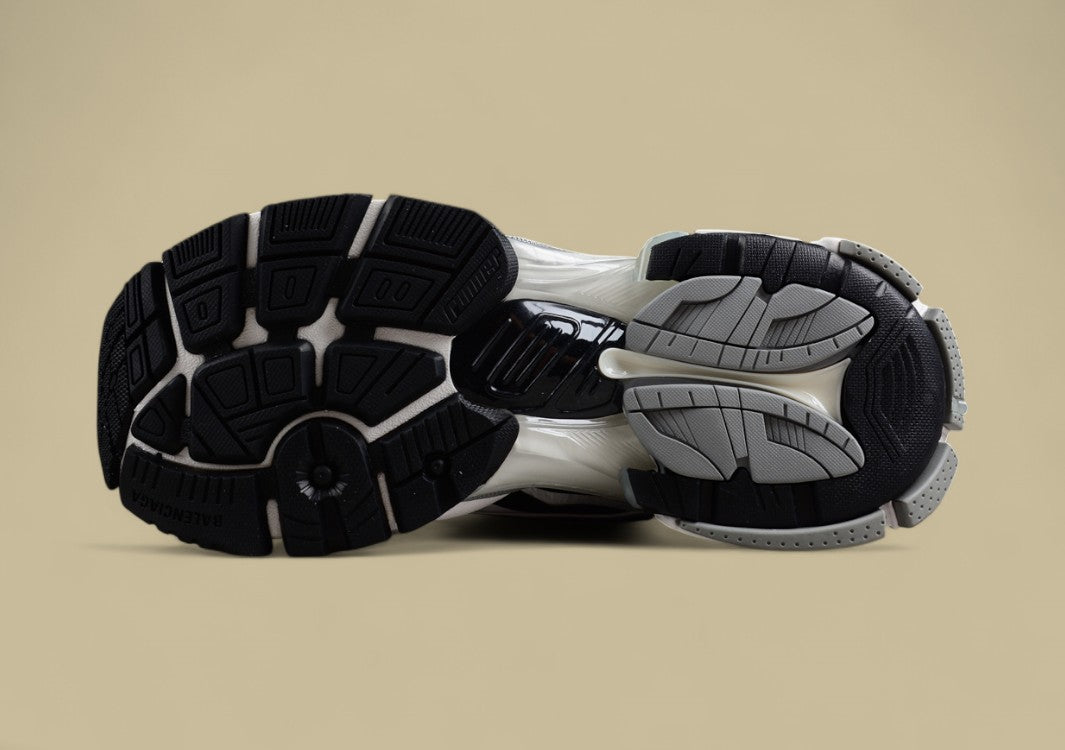 Balenciaga Runner Sneaker in a white, grey, and black