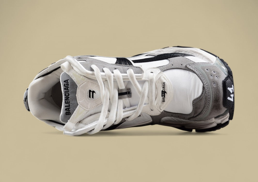Balenciaga Runner Sneaker in a white, grey, and black