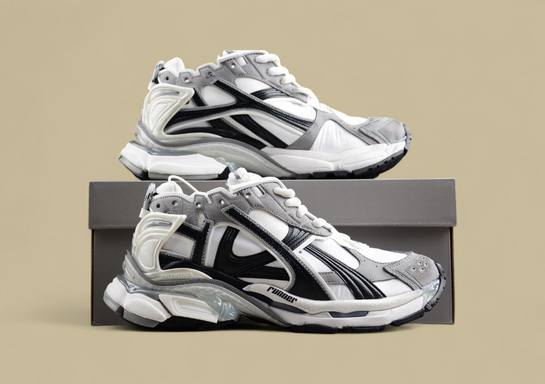 Balenciaga Runner Sneaker in a white, grey, and black