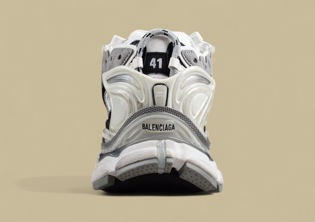 Balenciaga Runner Sneaker in a white, grey, and black
