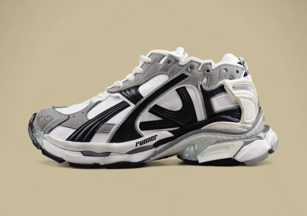 Balenciaga Runner Sneaker in a white, grey, and black