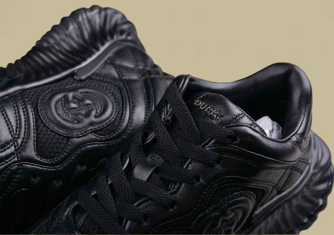 Gucci Black Sculpted Sneakers Futuristic Leather Runners with Monochrome GG Design
