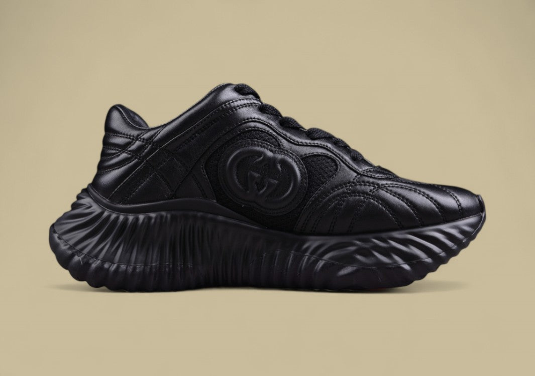 Gucci Black Sculpted Sneakers Futuristic Leather Runners with Monochrome GG Design