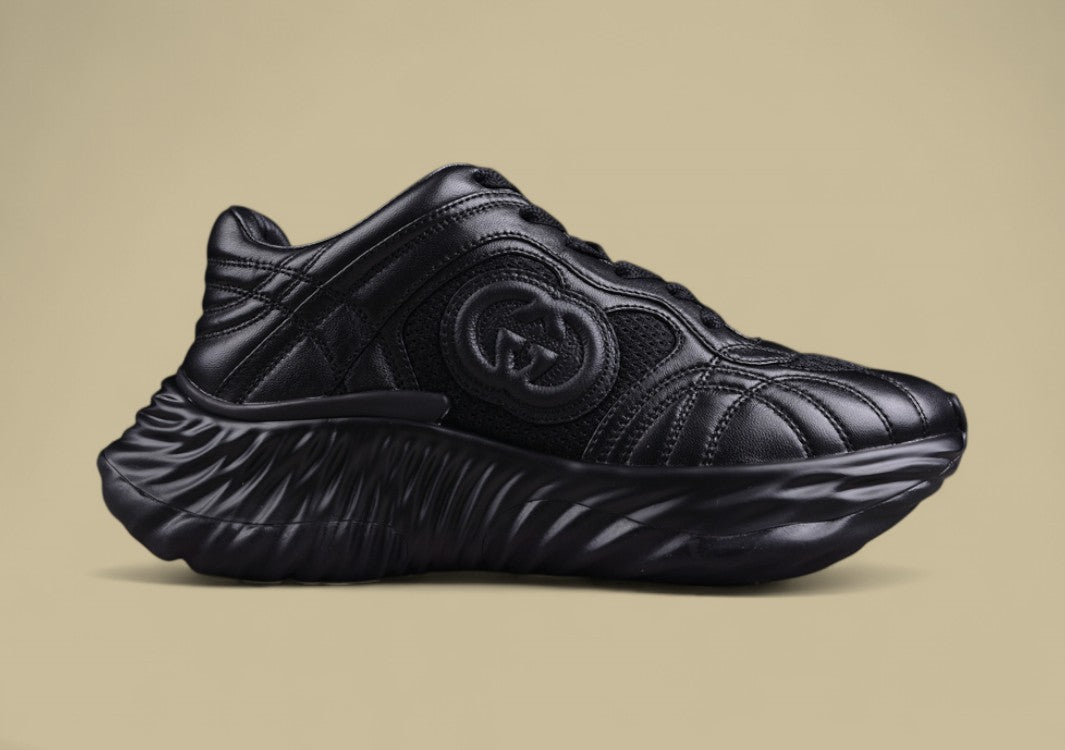 Gucci Black Sculpted Sneakers Futuristic Leather Runners with Monochrome GG Design