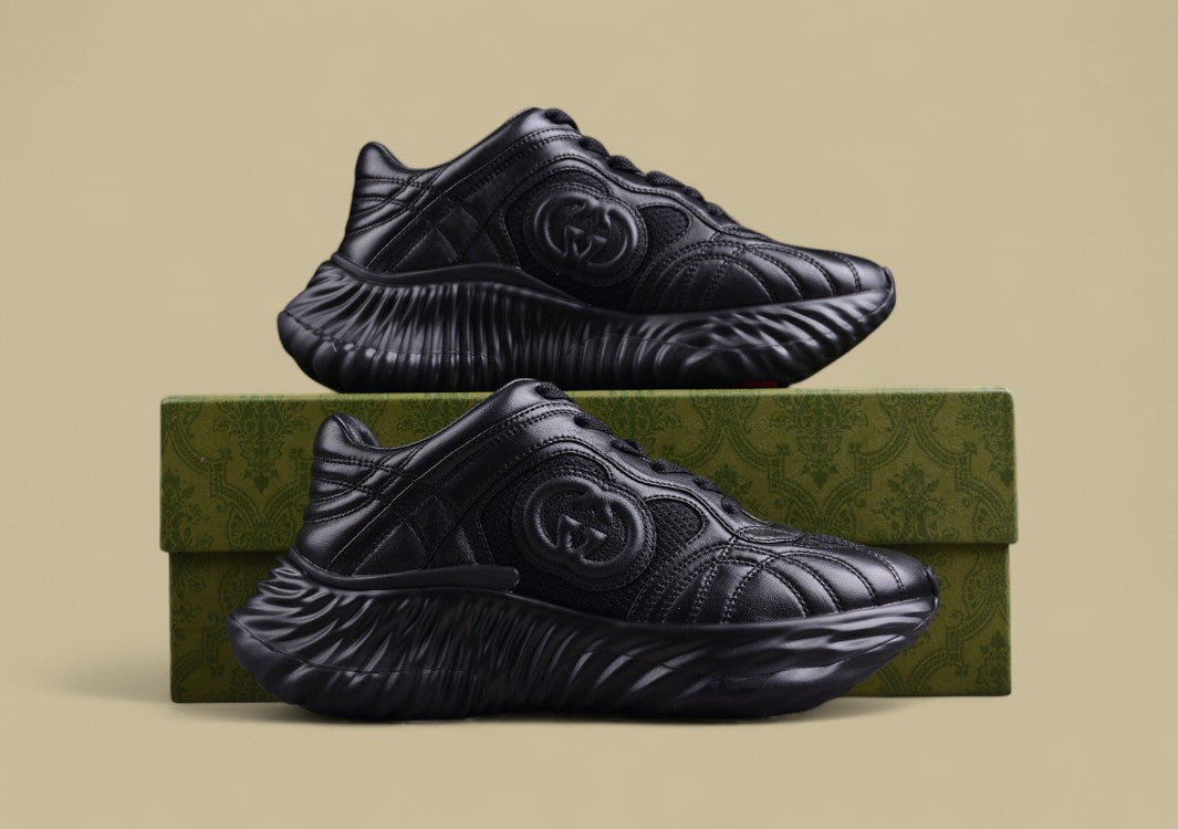 Gucci Black Sculpted Sneakers Futuristic Leather Runners with Monochrome GG Design