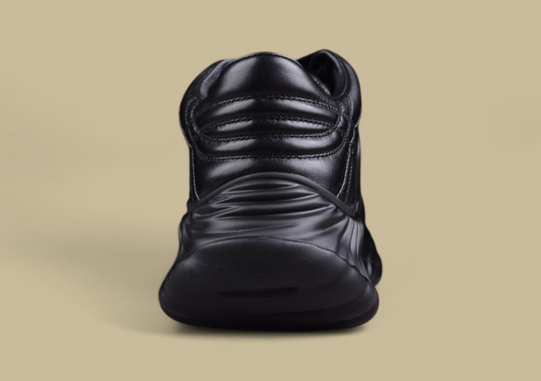 Gucci Black Sculpted Sneakers Futuristic Leather Runners with Monochrome GG Design