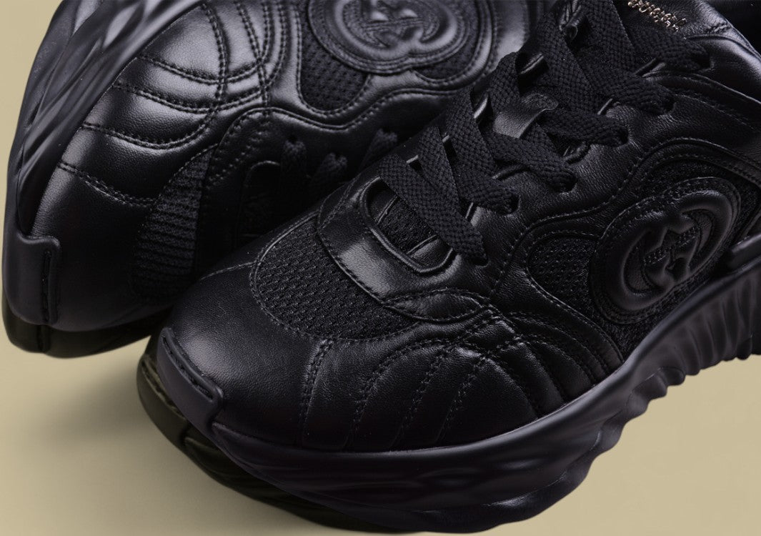 Gucci Black Sculpted Sneakers Futuristic Leather Runners with Monochrome GG Design