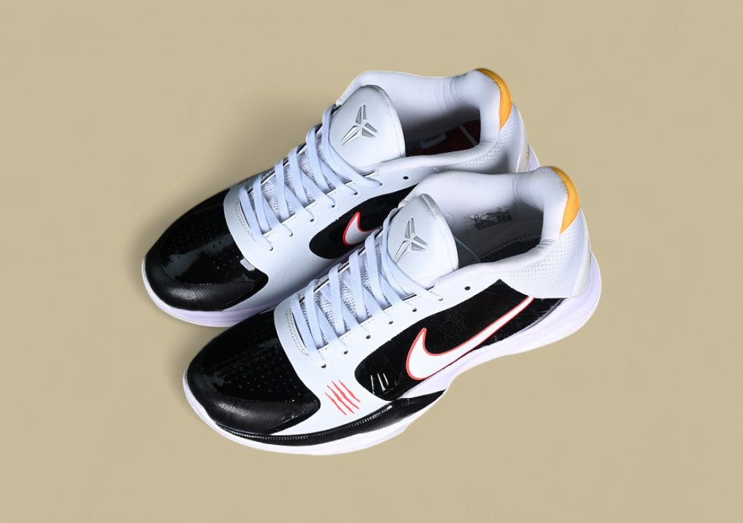 Nike Kobe ChNike Kobe Chaos White Black Gold Red Sleek Low-top Design With Glossy Panels and Bold Accentsaos Black gold Bold Yellow and Black Colorway With Red Details and Low-top Build (Copy)