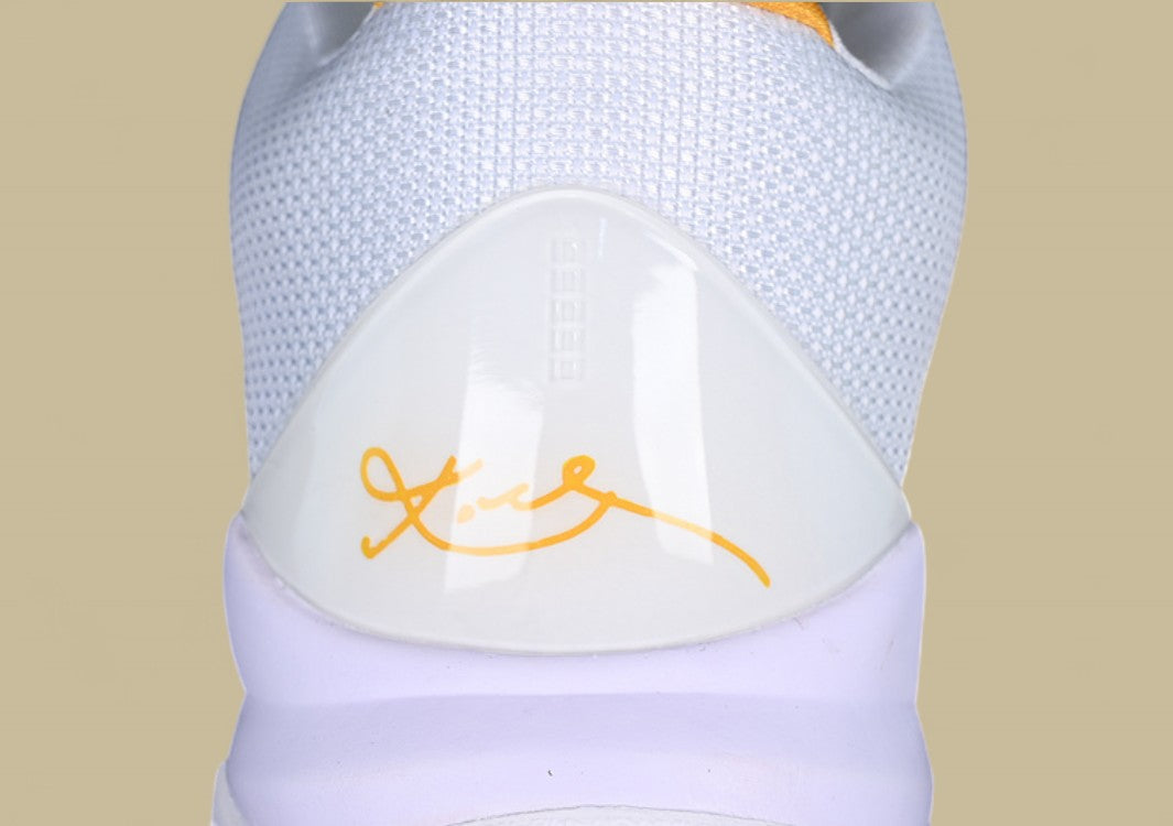 Nike Kobe ChNike Kobe Chaos White Black Gold Red Sleek Low-top Design With Glossy Panels and Bold Accentsaos Black gold Bold Yellow and Black Colorway With Red Details and Low-top Build (Copy)