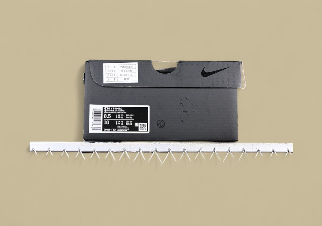 Nike Kobe ChNike Kobe Chaos White Black Gold Red Sleek Low-top Design With Glossy Panels and Bold Accentsaos Black gold Bold Yellow and Black Colorway With Red Details and Low-top Build (Copy)