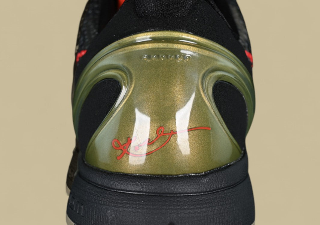 Nike Kobe Protro Orange Black Green Sleek Snakeskin Texture With Bold Crimson Swoosh Accent