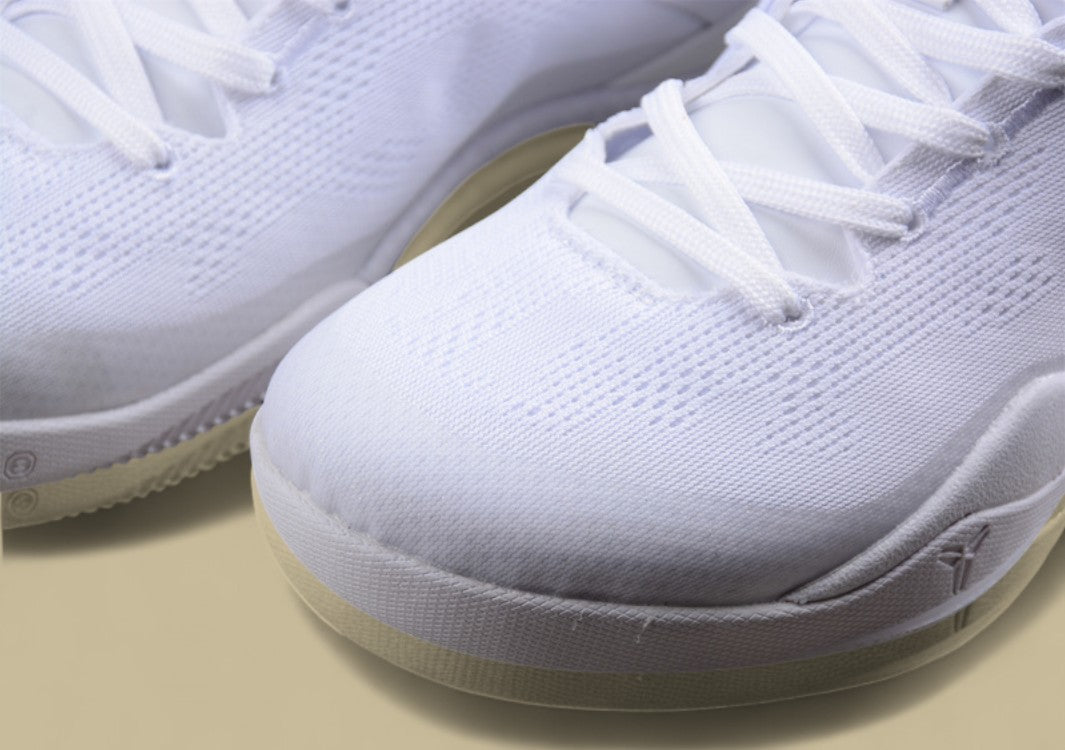 Nike Kobe Protro Triple White Sleek All-white Low-top Basketball Shoe With Minimalist Design