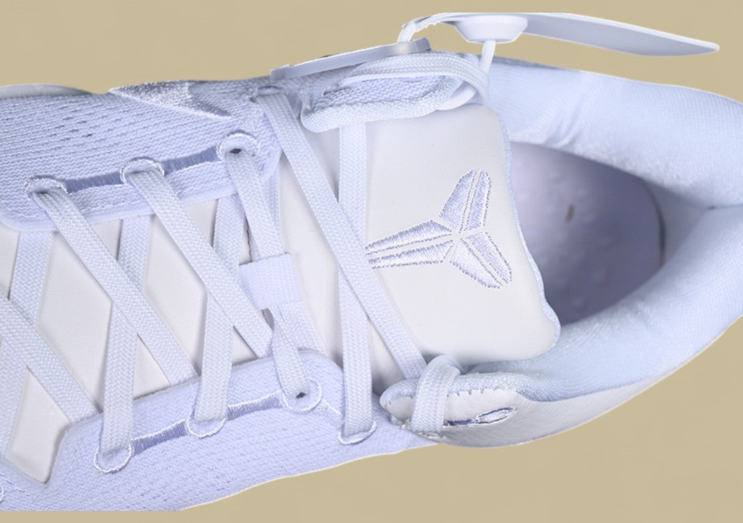 Nike Kobe System White Clean Triple-white Low-top Basketball Shoe With Sleek Minimalist Design