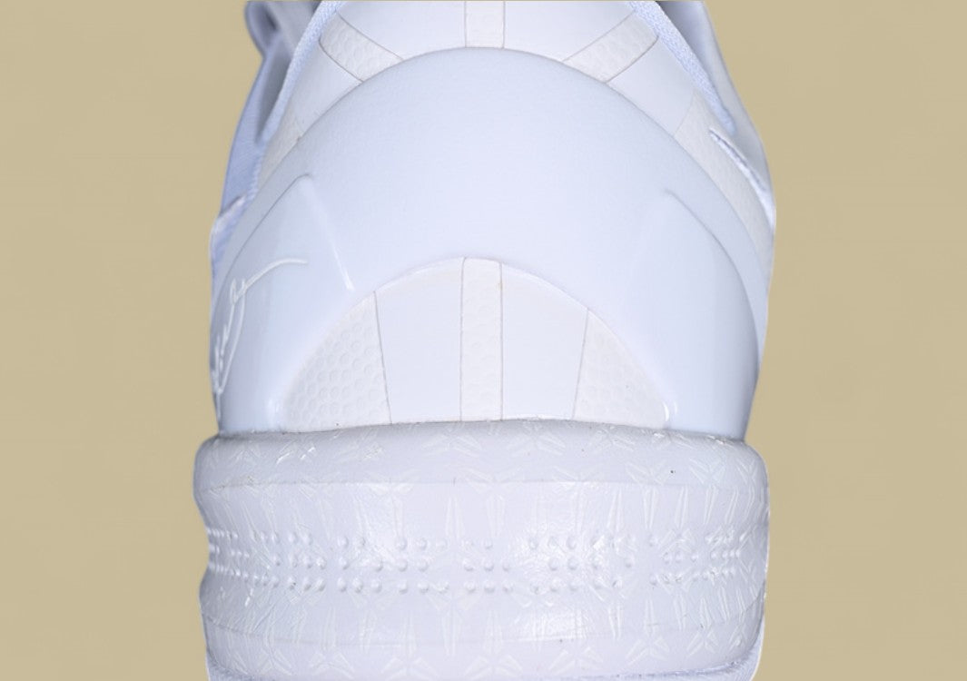 Nike Kobe System White Clean Triple-white Low-top Basketball Shoe With Sleek Minimalist Design