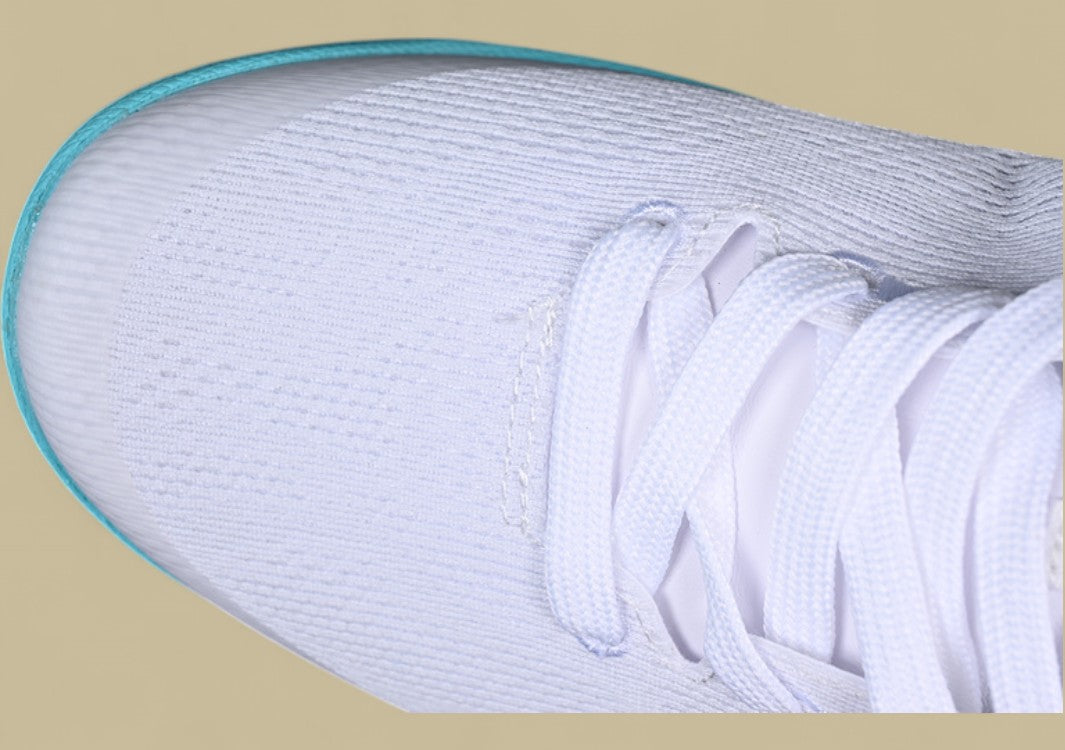 Nike Kobe System White green Fresh Aqua Accents on Sleek Low-top Performance Basketball Shoe