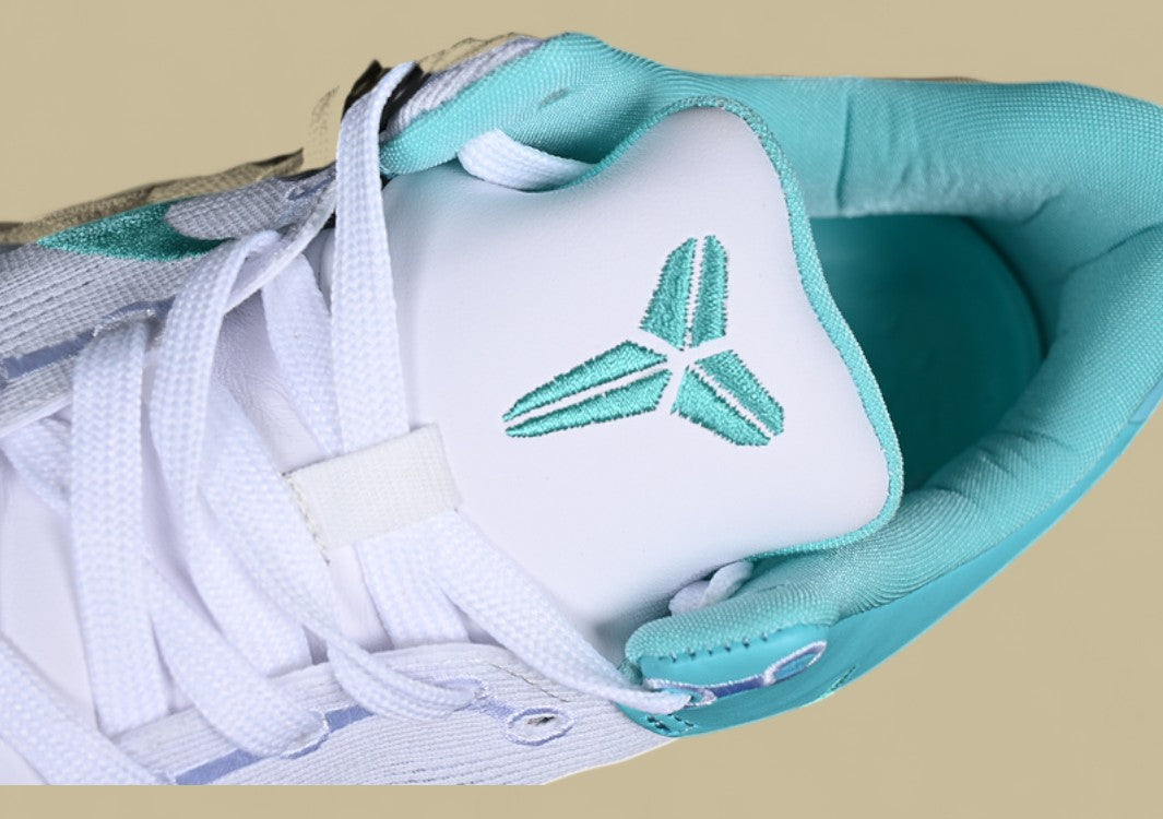 Nike Kobe System White green Fresh Aqua Accents on Sleek Low-top Performance Basketball Shoe
