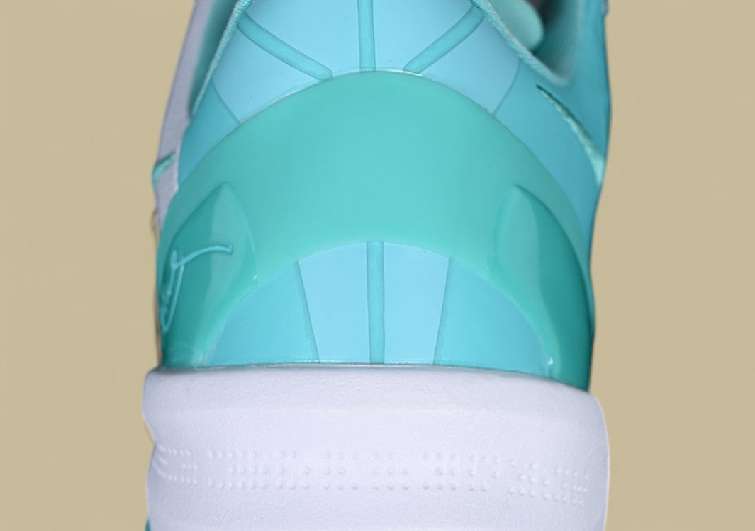 Nike Kobe System White green Fresh Aqua Accents on Sleek Low-top Performance Basketball Shoe