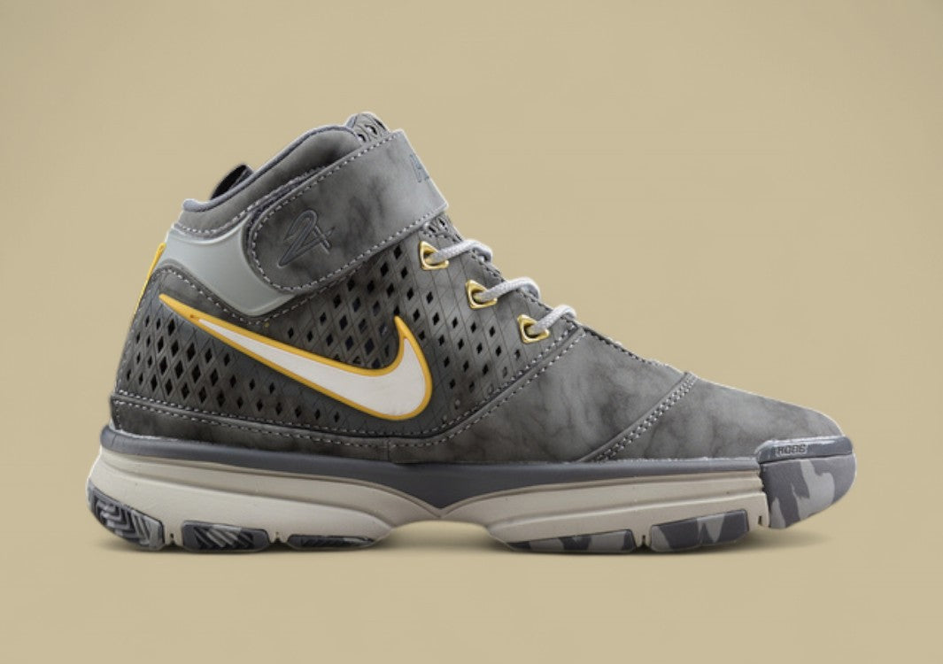 Nike Kobe White Grey Yellow Mid-top Basketball Shoes With Perforated Panels and Camo Outsole