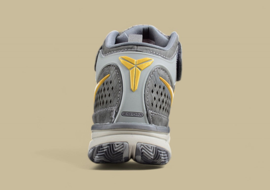Nike Kobe White Grey Yellow Mid-top Basketball Shoes With Perforated Panels and Camo Outsole