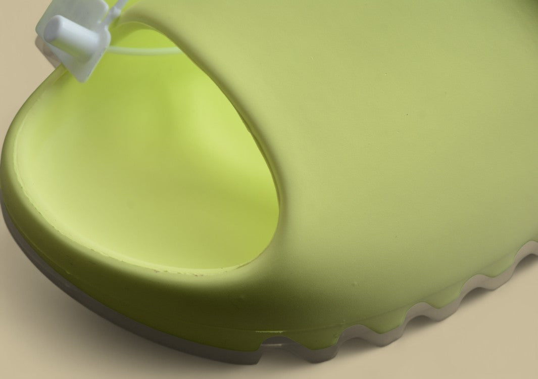 Yeezy Slide “Glow Green” Vibrant Comfort by Kanye